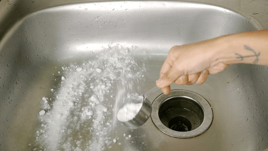 Baking Soda and Vinegar: Start by pouring half a cup of baking soda down the drain, followed by half a cup of vinegar. Let the mixture fizz and work its way through the pipes for about 30 minutes. Then, flush the pipes with hot water to wash away the loosened debris and buildup.