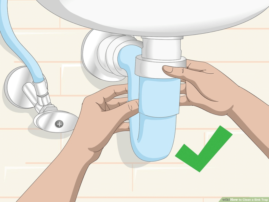 To clean the waste pipe under your sink, start by placing a bucket beneath the pipe to catch any water or debris. Then, use a wrench to loosen the nuts connecting the pipe and remove it. Scrub the pipe with a brush or cloth to remove any buildup or clogs. Finally, reassemble the pipe and ensure the nuts are securely tightened.